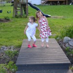 bridge between two back yards, with girls lauging