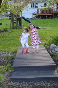 bridge between two back yards, with girls lauging